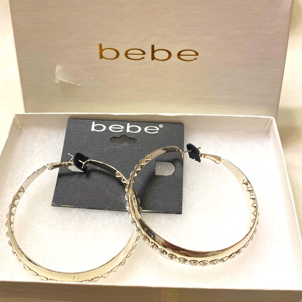 Silver toned bene earrings, large hoops.NWT